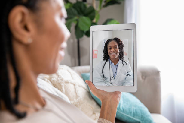 Mature woman discusses health issue with doctor during a telehealth appointment